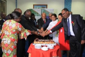 Group CEO of Ethiopian Airlines with others cutting a cake to signify the launch of the new flights