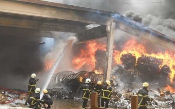 A photo of firefighters at the Makola Market during one of their fires