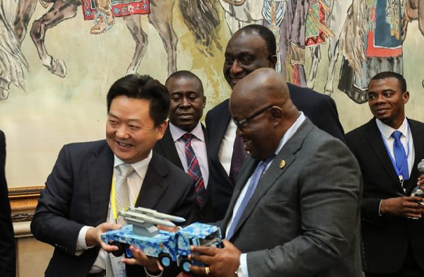 Zhang Yuzong presenting a miniature version of the types of trucks to be manufactured in Ghana