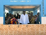 Charles Asuako Owiredu (MP) in white, standing with community leaders