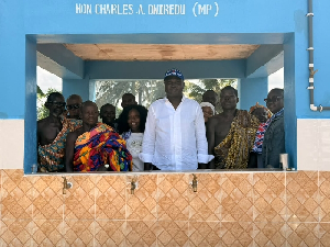 Charles Asuako Owiredu (MP) in white, standing with community leaders