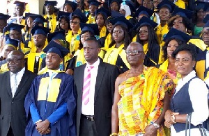 Mr. Darko-Mensah (3rd right) in a photograph with the graduates