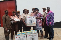 Catherine Cudjoe donating the items to the prison officers