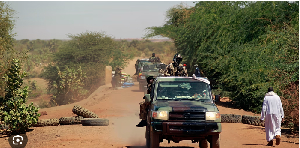 Malian soldiers patrol the entrance of Gao, northern Mali, 8 February 2013