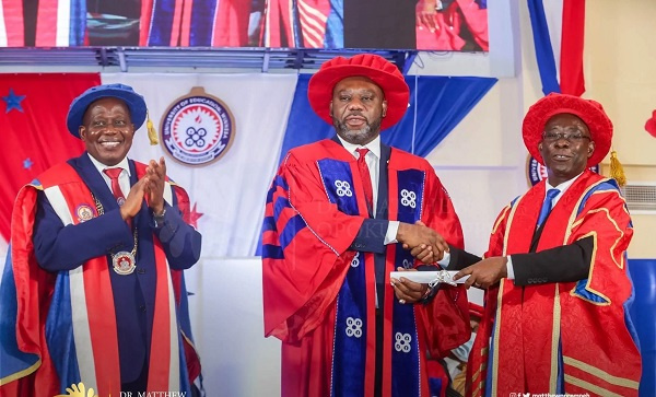 Dr. Mathew Opoku Prempeh (middle)