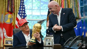 Donald Trump (seated) was excited to touch the World Cup trophy