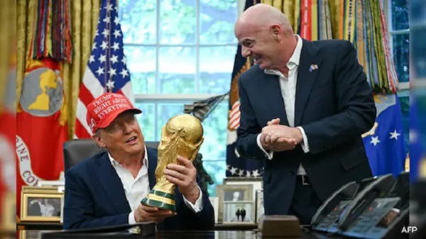 Donald Trump (seated) was excited to touch the World Cup trophy