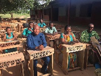 Samuel Okudzeto Ablakwa, MP for North Tongu seated in one of the desks with others
