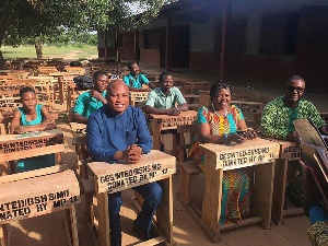 Samuel Okudzeto Ablakwa, MP for North Tongu seated in one of the desks with others
