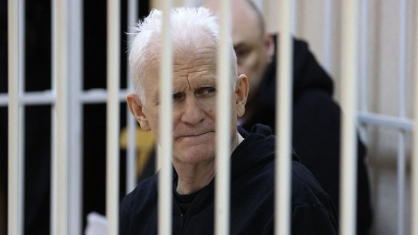 Nobel Prize winner Ales Bialiatski is seen in the defendants' cage in the courtroom