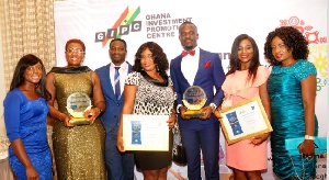 Management of GLICO displaying their awards
