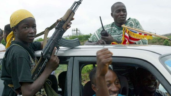 Liberian rebels celebrate in Monrovia in August 2003. PHOTO | FILE | NMG