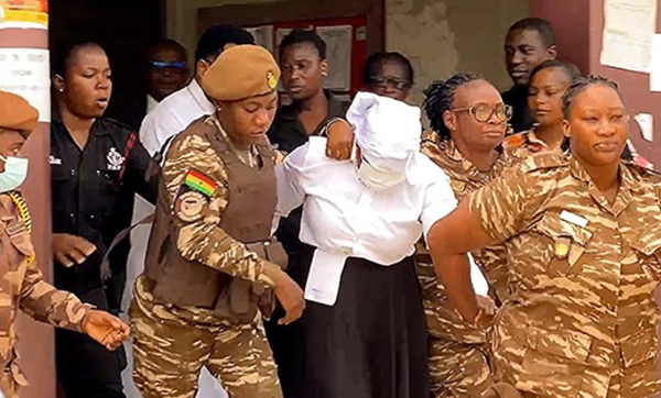 Agradaa being escorted out of the court premises by Prisons Service personnel