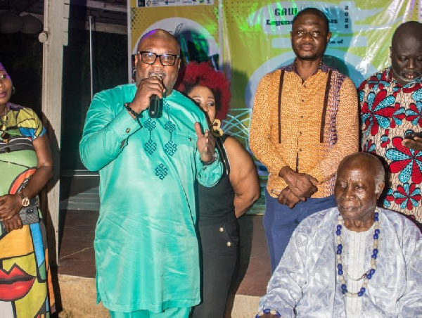 Prof Ladé Wosornu (seated R) with Gideon Aryeequaye of the Creative Arts Agency (L)