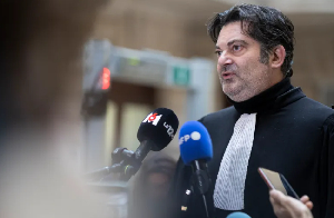 French lawyer Randall Schwerdorffer talks to the media as he leaves the courtroom