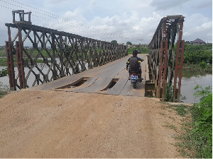 Motorist crossing deadly bridge with holes