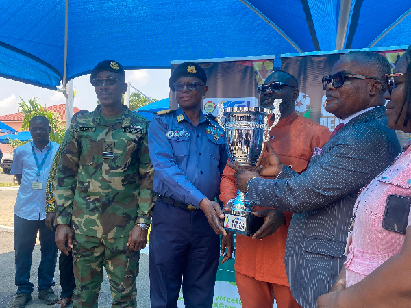 (In blue) Rear Admiral Livinus Bessing received the trophy on behalf of Chief of Defense Staff