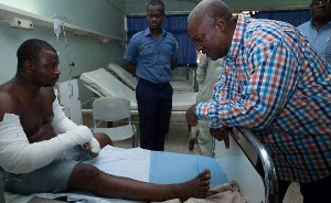 Mr Mahama interacting with one of the victims at the hospital