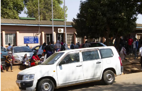 Malawians line up at immigration offices in Lilongwe, as demand for passports surges