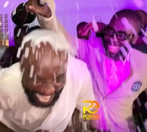Highlife musician, Kwabena Kwabena being sprayed with champagne at his birthday party