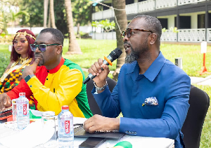 Kofi Okyere-Darko [R] with Abeiku Santana [C] during the event