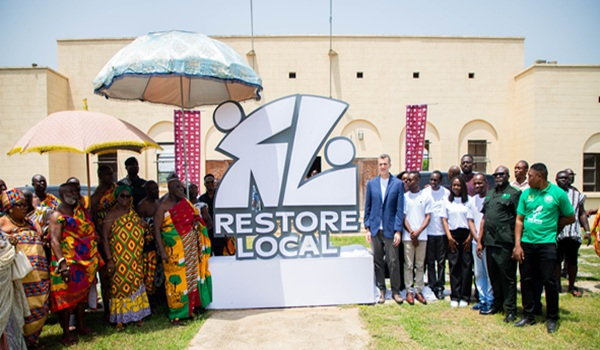 Members of Restore Local in a photo wiht key stakeholders during the launch