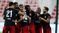 Asamoah Gyan celebrating with his Al Ahli teammates