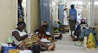 Mothers and pregnant women in a hallway of a maternity ward waiting for treatment at the hospital
