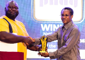 Bright W Ladzekpo receiving his award at the National FMCG Awards