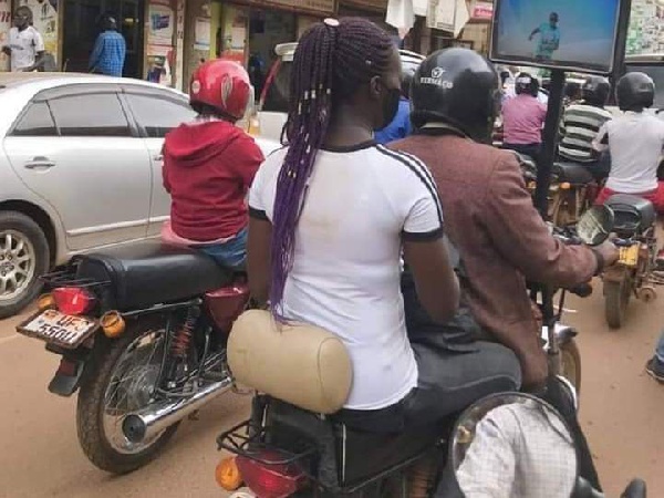 Okada rider places TV on his motor bike