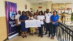 Kate Agamah (3rd from the right) Head, Transaction Banking, Stanbic Bank Ghana presenting the cheque