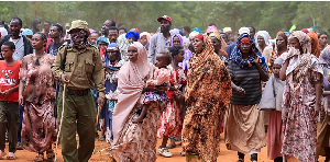 Ethiopian refugees fleeing fighting in southern Ethiopia gather at a camp in Moyale, Kenya, Oct. 30