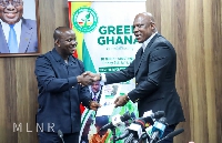 Lands Minister, Samuel Abu Jinapor receiving the comminique from Mr Ato Afful