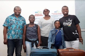 Abeiku Santana (in black t-shirt) poses with the kids as they leave for Turkey