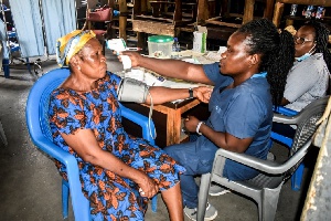 A resident of Adabraka undergoing medical review as part of the health screening exercise