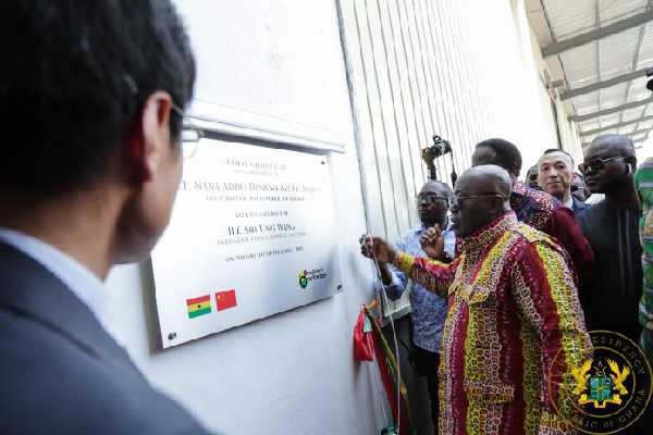 President Akufo-Addo unveiling the plaque for the commissioning of the factory