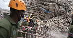 Police dispel crowds with tear gas after 16-storey building collapses in Nairobi Police dispel crowds with tear gas after 16-storey building collapses in Nairobi