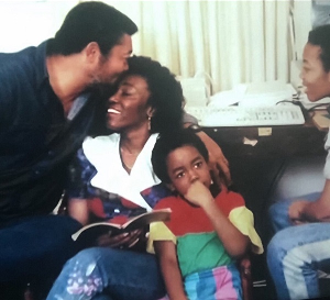 Late former President JJ Rawlings is seen affectionately kissing his wife on the forehead
