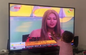 Yvonne Nelson's daughter, Ryn trying to touch her mother on the TV screen