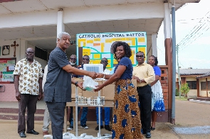 Members of the District Grand Lodge of Ghana (English Constitution) donating to the Anyako Community