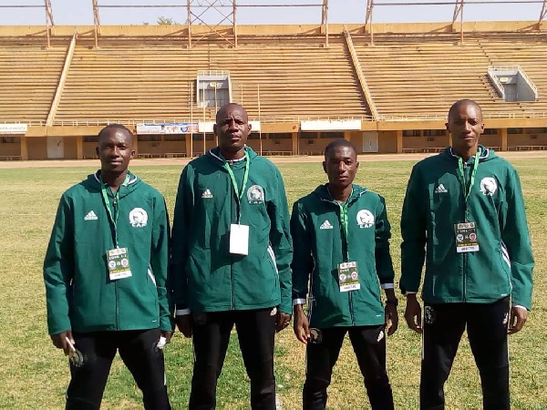 Referee Vincent Kabore with his assistants