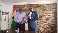Former President John Mahama and Bola Ray take a picture after their meeting
