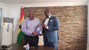 Former President John Mahama and Bola Ray take a picture after their meeting