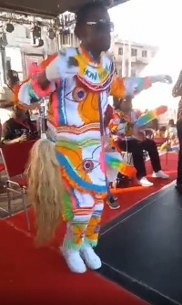 Western Regional Minister, Kwabena Okyere Darko-Mensah on  a stage dancing