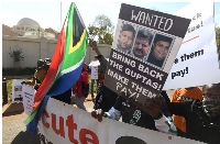A group of people protest outside the United Arab Emirates' (UAE) embassy
