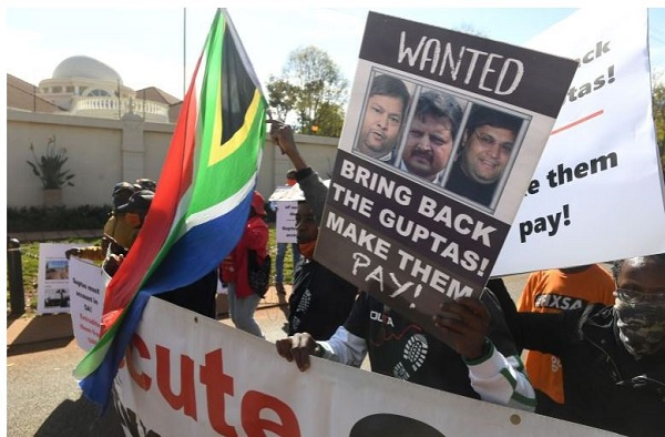 A group of people protest outside the United Arab Emirates' (UAE) embassy