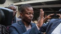 Malawian preacher Shepherd Bushiri waves at sympathisers as he leaves the Lilongwe Magistrate court
