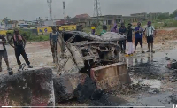 A picture of the burnt car at the scene