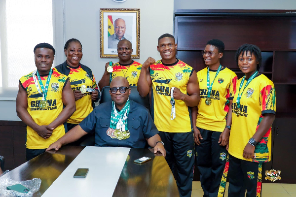 NHIA boss Dr Bampoe (seated) has vowed to invest in armwrestling in Ghana