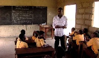 File Photo of a teacher and some pupils